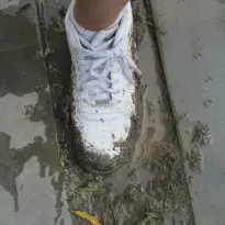 Nike AF1s in the mud